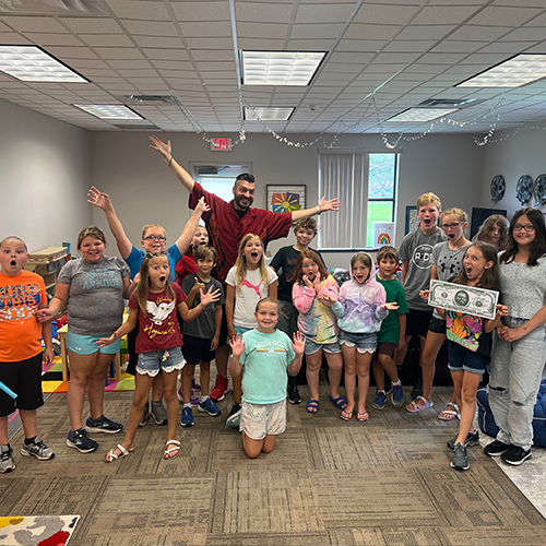 photo of day campers with magician