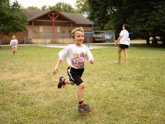 camper running in open field