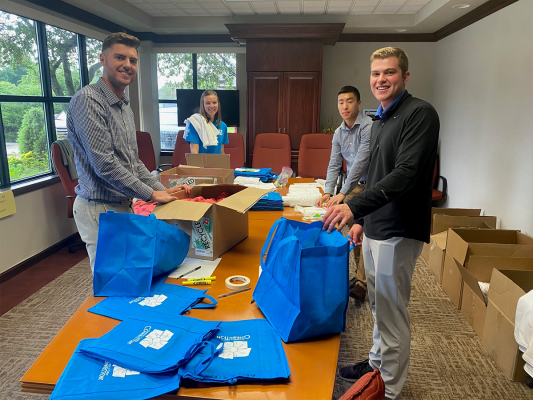 office volunteers stuffing bags