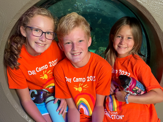 three day campers in front of the zoo aquarium